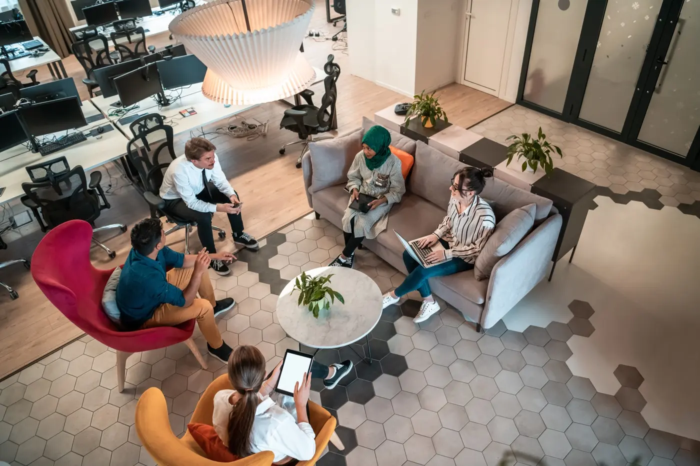 An open plan co-working lounge seen from above, the kind of space Dubai's fintech founders work from