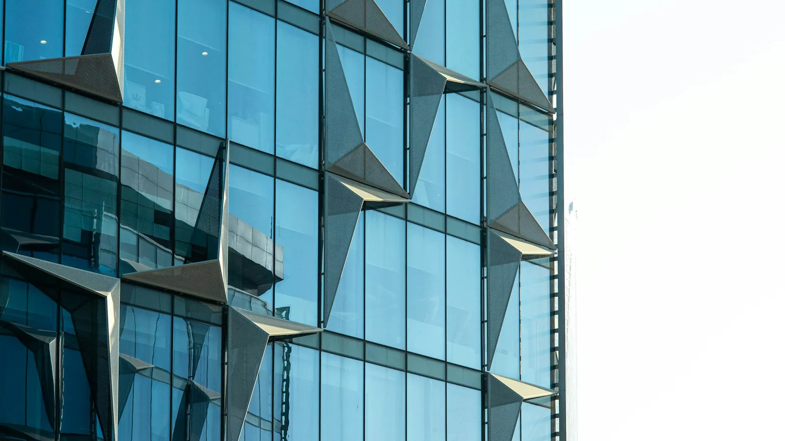 The glass facade of a Dubai tower, the destination for a UK company moving over