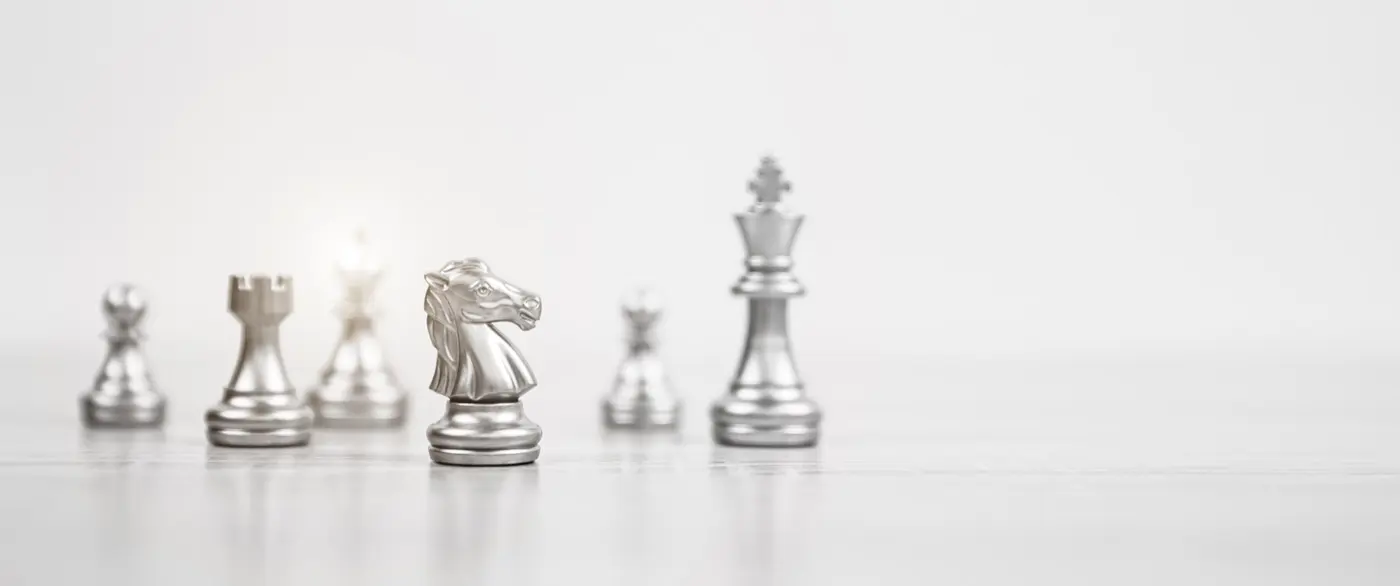 Chess pieces arranged on either side of a board, the question of who decides what in a family office