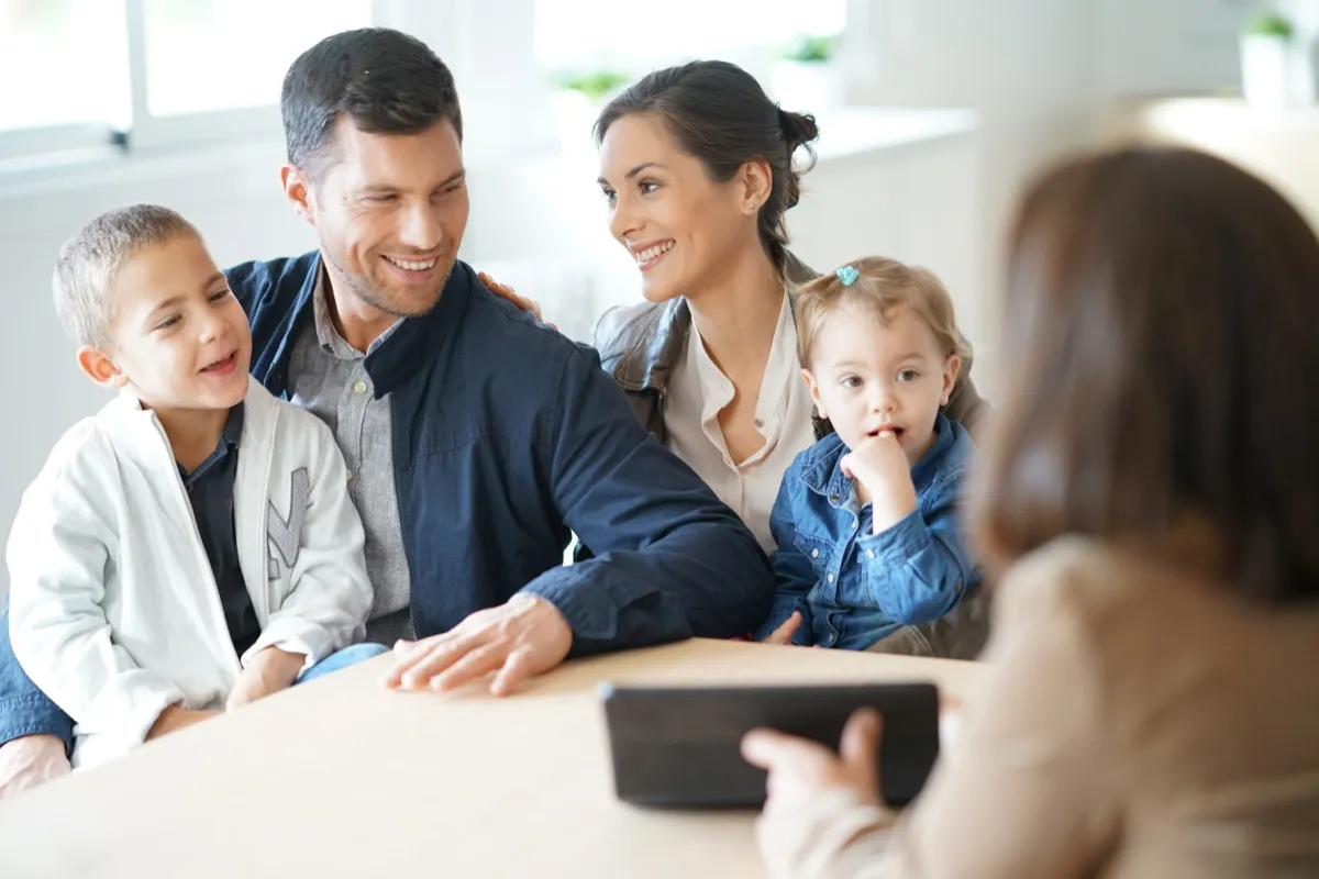 A family with young children meeting an adviser, the move a family office relocation actually is