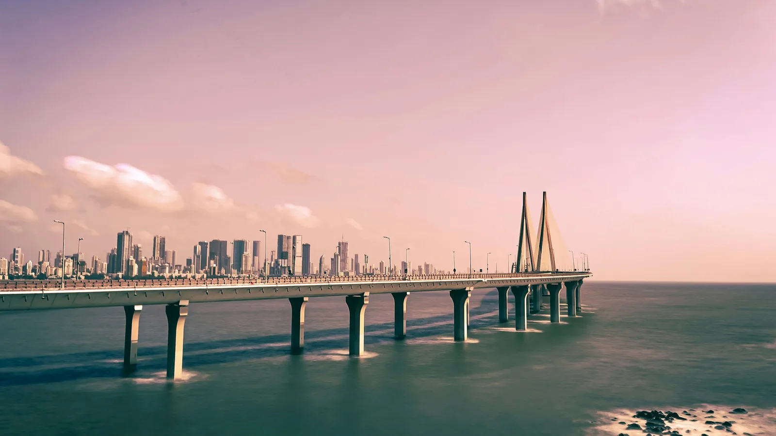 Mumbai's skyline behind the sea link at dusk, the market many DIFC investors are structuring from