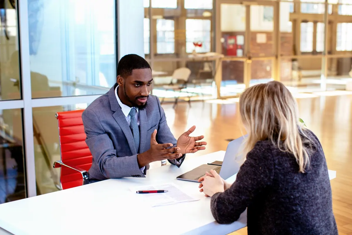 An adviser explaining a document to a client, the conversation the shared tools are designed to support